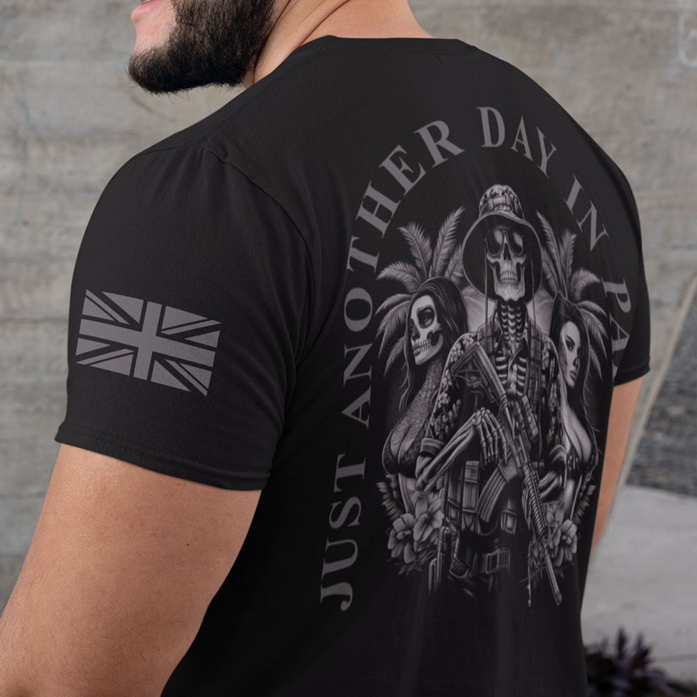 Back view of man wearing Black short sleeve unisex fit classic cotton T-Shirt by Achilles Tactical Clothing Brand printed with Large another day in paradise design across back