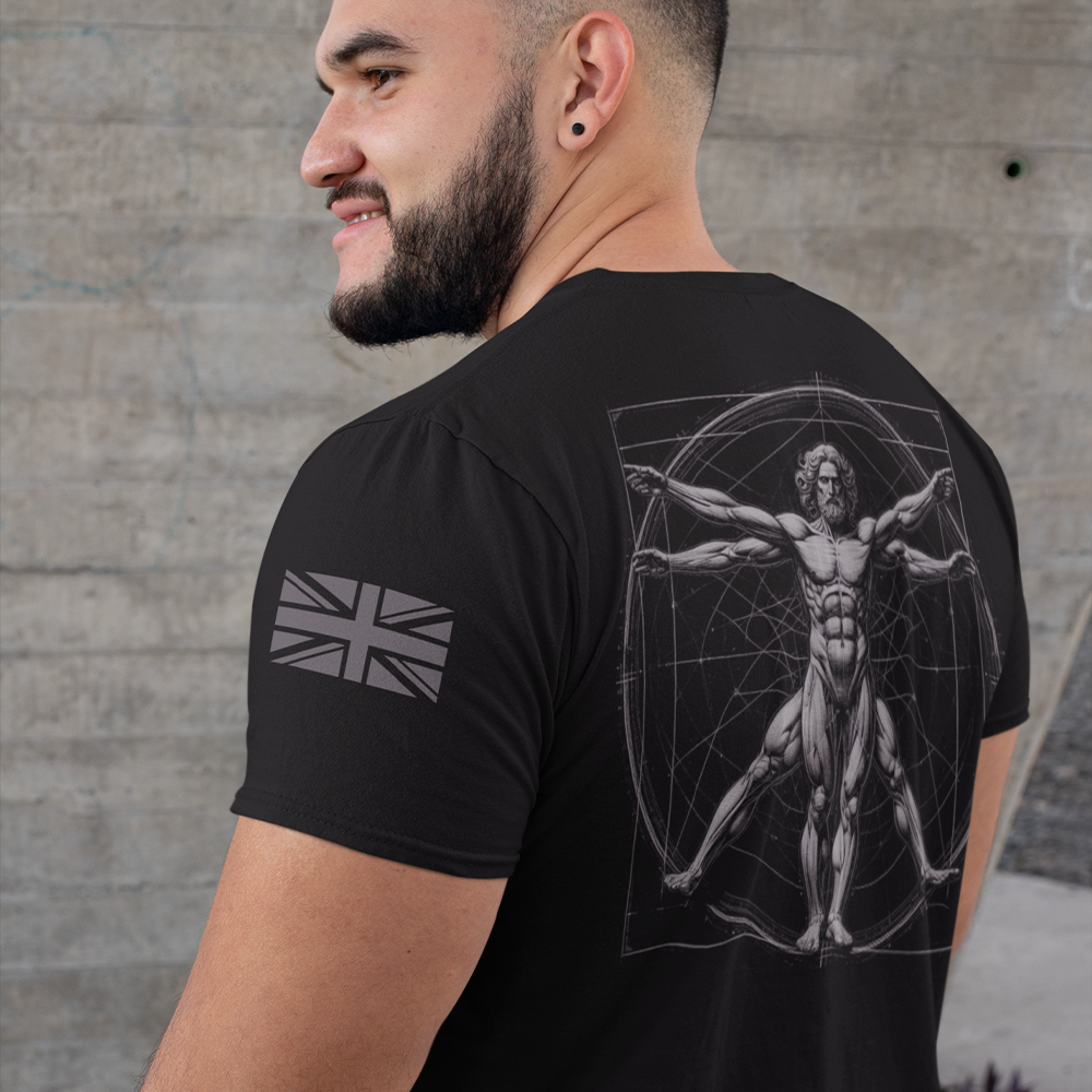 Back view of man wearing black short sleeve unisex fit original cotton T-Shirt by Achilles Tactical Clothing Brand printed with Large Vitruvian man design across back