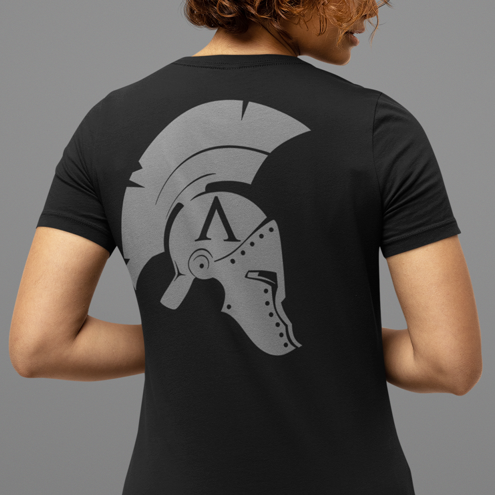 Back view of woman wearing Black short sleeve unisex fit original cotton T-Shirt by Achilles Tactical Clothing Brand printed with Icon branded design across back