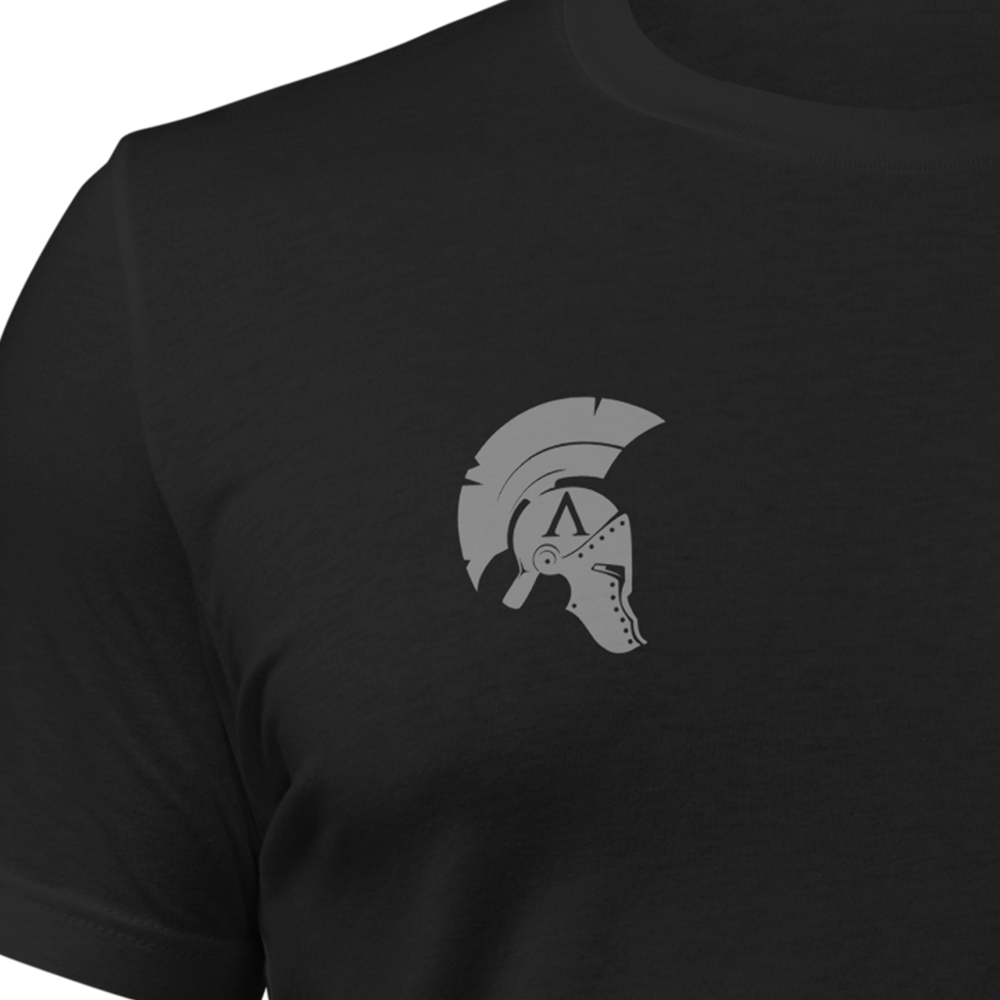 Close up of front chest of Black short sleeve unisex fit original cotton T-Shirt by Achilles Tactical Clothing Brand printed with Wolf Grey small Icon logo on right chest stormtrooper helmet design