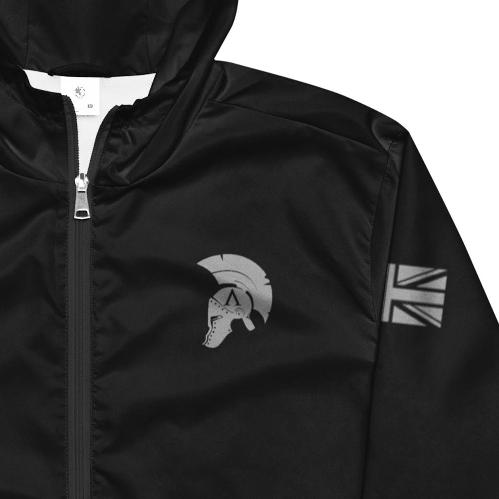 Close up Front view of  hood up long sleeve unisex fit windbreaker track jacket by Achilles Tactical Clothing Brand printed with Achilles logo on chest and helmet design and union flag in wolf grey on left sleeves
