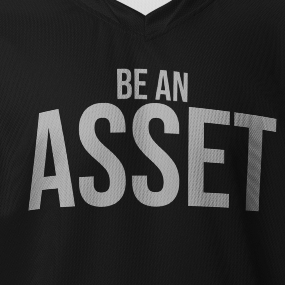 Close up of front of Black Achilles Tactical Clothing Brand activewear T-Shirt with BE AN ASSET design across chest
