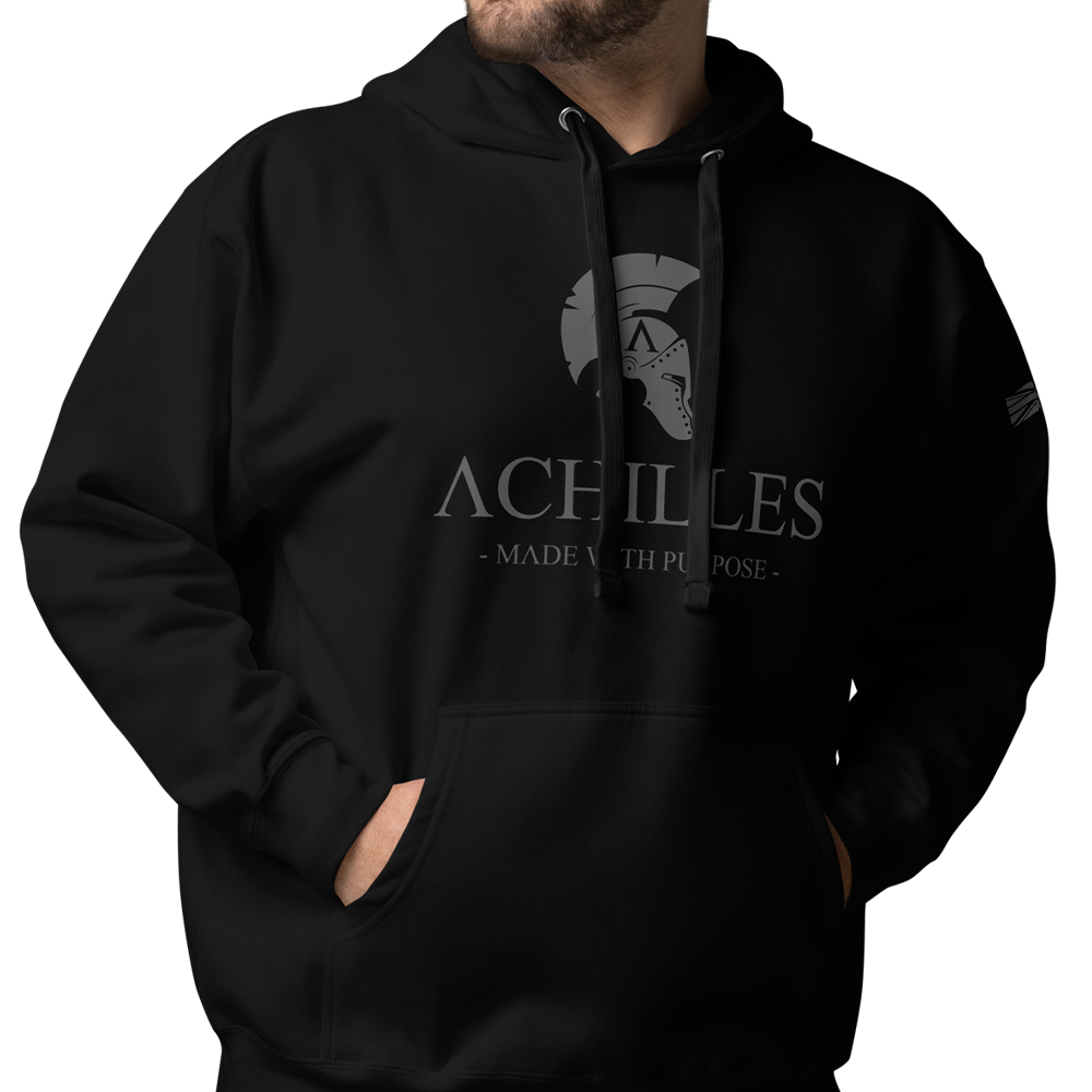 Close up of Front of man wearing Black unisex fit hoodie by Achilles Tactical Clothing Brand with Wolf Grey Signature Design across chest