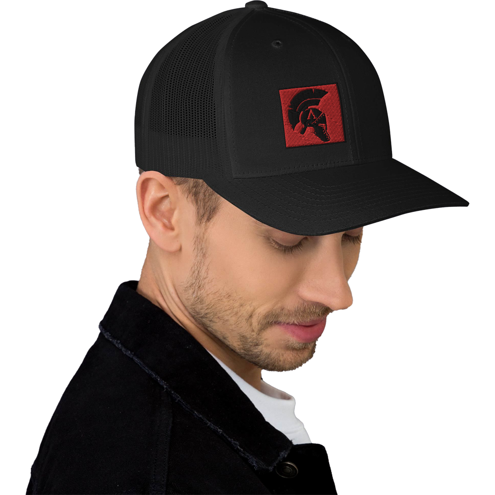 Man wearing front right mesh snap back embroidered achilles black cap