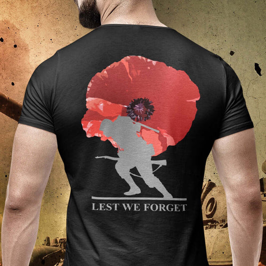 Back view of Man wearing black short sleeve unisex fit cotton T-Shirt by Achilles Tactical Clothing Brand printed with soldier and poppy lest we forget across the back.
