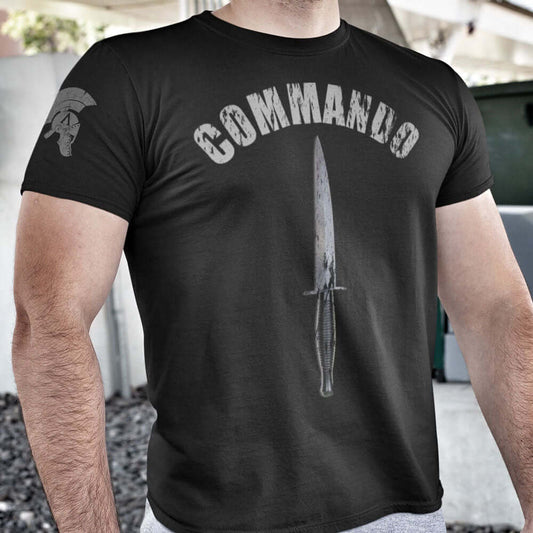 Close up of Man wearing Black short sleeve unisex fit cotton T-Shirt by Achilles Tactical Clothing Brand printed with Commando and Dagger design across the front chest