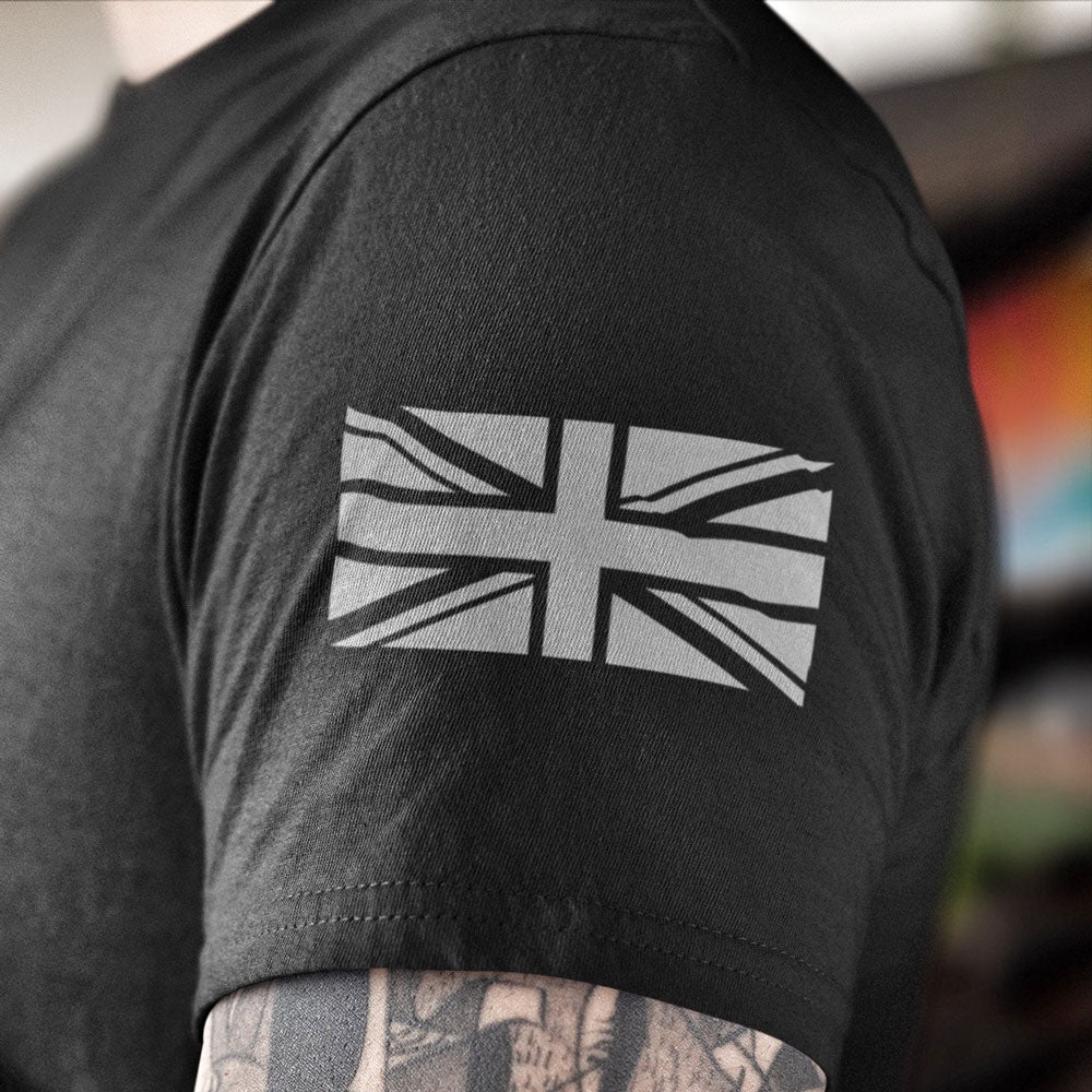 Close up of High Definition grey union flag printed on left sleeve of black cotton short sleeve unisex fit T-Shirt by Achilles Tactical Clothing Brand