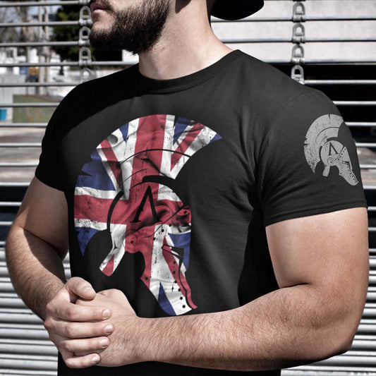Man Wearing Black short sleeve unisex fit cotton T-Shirt by Achilles Tactical Clothing Brand printed with Large Achilles Icon Helmet with Union flag across the chest by Achilles Tactical Clothing Brand