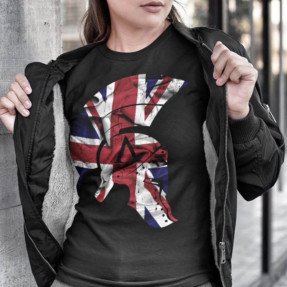 Woman Wearing Black short sleeve unisex fit cotton T-Shirt by Achilles Tactical Clothing Brand printed with Large Achilles Icon Helmet with Union flag across the chest by Achilles Tactical Clothing Brand