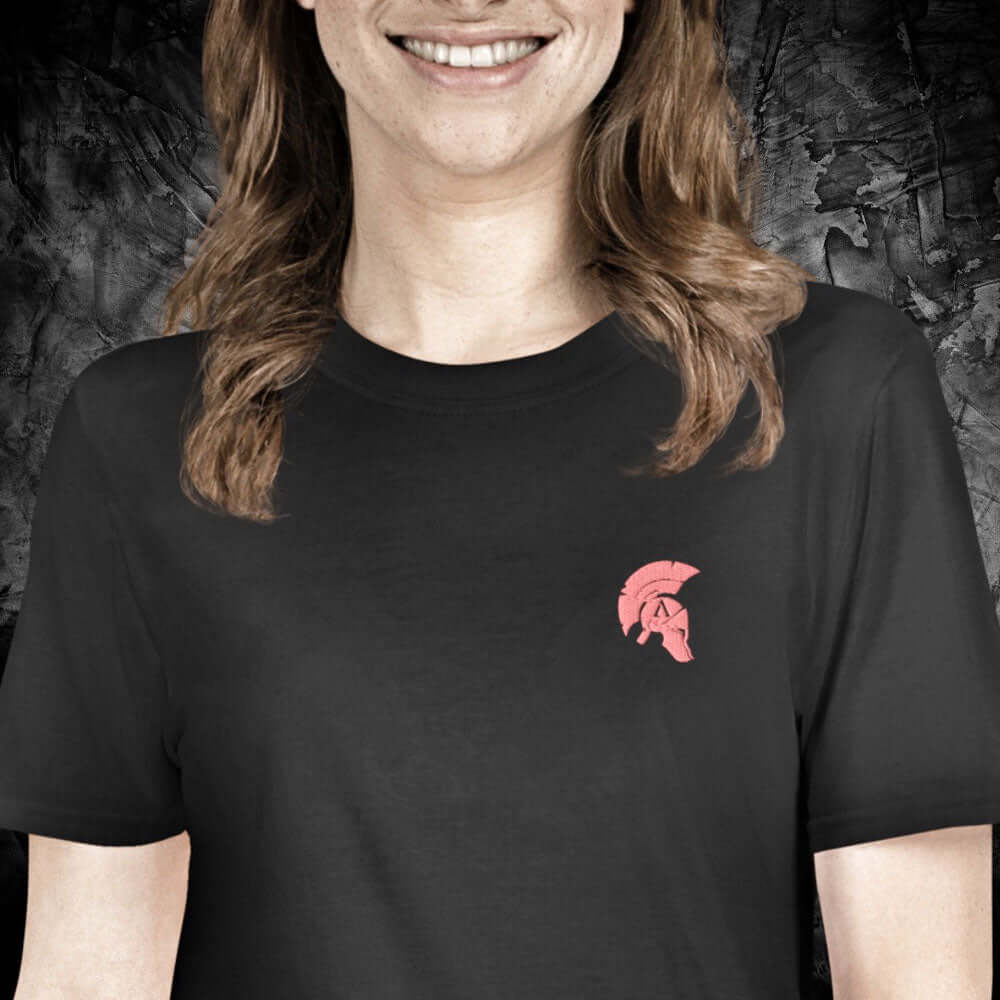 Woman wearing a black cotton Achilles Clothing Brand T-Shirt with Achilles Icon Helmet Embroidered on Left Chest