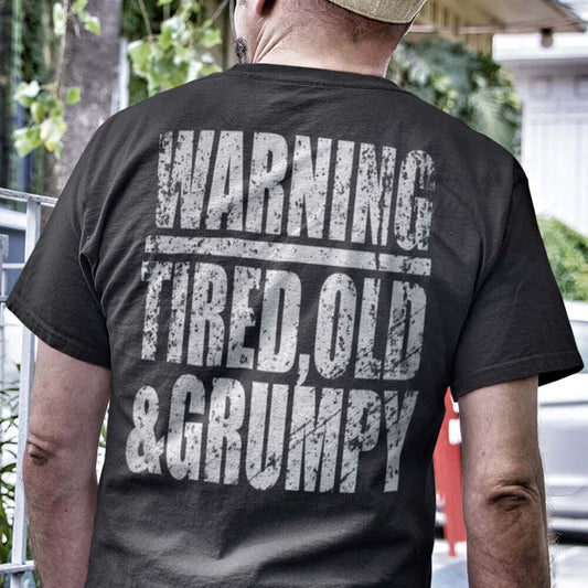 Man Wearing Achilles Branded WARNING TIRED OLD & GRUMPY Design On Back Of Black 100% Cotton Short Sleeve T-Shirt Back Print by Achilles Tactical Clothing Brand